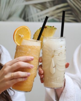 a pair sitting and smiling